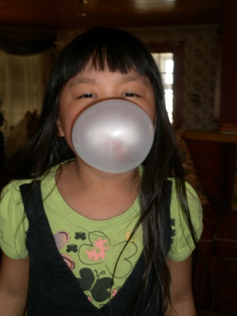 Kasen blowing a bubble